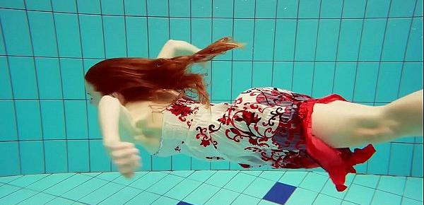  Hot Polish redhead swimming in the pool